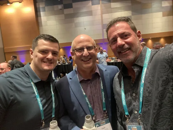 Rob Lancit and two men with conference lanyards in a selfie