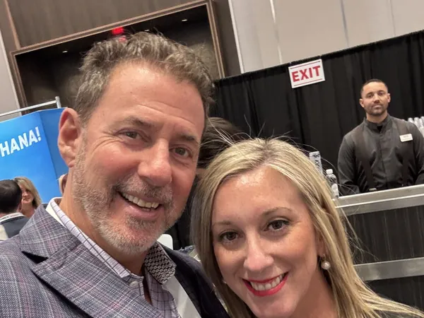 Rob Lancit and a woman in a selfie at a convention