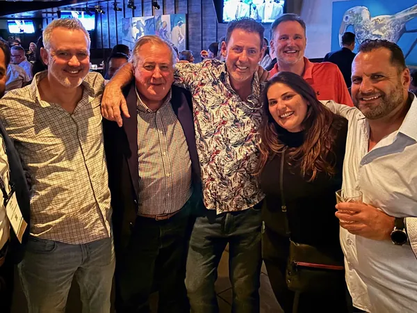 Rob Lancit with six friends at a night event